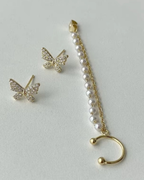Elegant pearl tassel and butterfly chain earrings, perfect for sophisticated jewelry collections and stylish accessories.