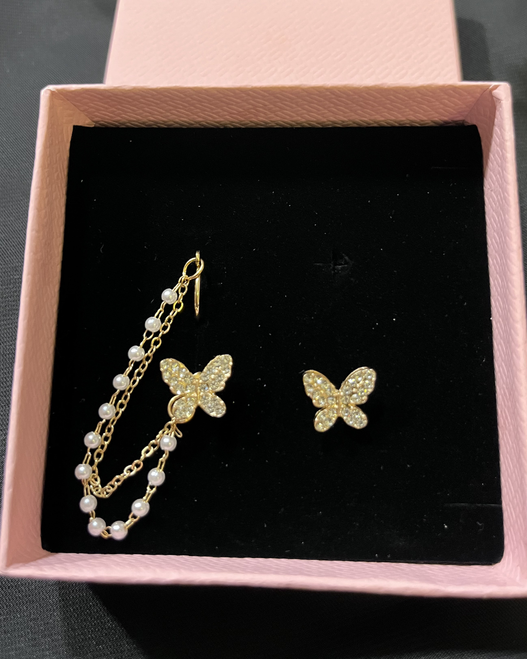 Elegant pearl tassel and butterfly chain earrings, perfect for sophisticated jewelry collections and stylish accessories.